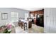 Modern kitchen with dark wood cabinets and a breakfast bar at 4685 Anson Ln, Orlando, FL 32814