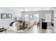 Spacious living room with light colored sofa and wood-look floors at 4685 Anson Ln, Orlando, FL 32814