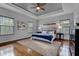 Large main bedroom with hardwood floors and a ceiling fan at 4685 Anson Ln, Orlando, FL 32814