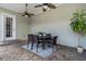 Outdoor patio with table, chairs, and ceiling fans at 4685 Anson Ln, Orlando, FL 32814