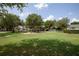 Community playground surrounded by lush trees at 4685 Anson Ln, Orlando, FL 32814