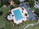 Community pool with plenty of lounge chairs at 4685 Anson Ln, Orlando, FL 32814