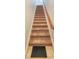 Indoor carpeted staircase with wood handrail at 4685 Anson Ln, Orlando, FL 32814