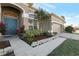 Inviting front entry with a teal door and nicely landscaped walkway at 4902 Brightmour Cir, Orlando, FL 32837