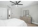 Spacious bedroom with a dresser and ensuite bathroom access at 5156 Tarragona Dr, Orlando, FL 32837