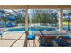 Relaxing screened patio with pool, spa, and outdoor furniture at 5156 Tarragona Dr, Orlando, FL 32837