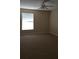 Large bedroom with ceiling fan and neutral carpeting at 5548 Metrowest Blvd # 310, Orlando, FL 32811