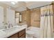 Bathroom with shower/tub combo, marble vanity, and tiled walls at 696 Youngstown Pkwy # 307, Altamonte Springs, FL 32714
