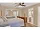 Bright bedroom with double bed, dresser, and mirrored closet doors at 696 Youngstown Pkwy # 307, Altamonte Springs, FL 32714