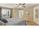 Bedroom with queen bed, dresser and access to bathroom at 696 Youngstown Pkwy # 307, Altamonte Springs, FL 32714