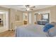 Bedroom with queen bed, dresser and mirrored closet doors at 696 Youngstown Pkwy # 307, Altamonte Springs, FL 32714