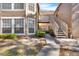 Exterior view of condo building showcasing stairs and landscaping at 696 Youngstown Pkwy # 307, Altamonte Springs, FL 32714