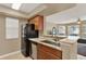 Kitchen with granite countertops, black appliances, and a breakfast bar at 696 Youngstown Pkwy # 307, Altamonte Springs, FL 32714