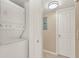 Stackable washer and dryer in a small laundry closet at 696 Youngstown Pkwy # 307, Altamonte Springs, FL 32714