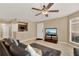 Living room with tile floors, comfortable seating, and a view of the kitchen at 696 Youngstown Pkwy # 307, Altamonte Springs, FL 32714