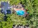Aerial view of a community pool surrounded by trees at 696 Youngstown Pkwy # 307, Altamonte Springs, FL 32714