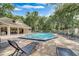 Community pool with lounge chairs and covered patio area at 696 Youngstown Pkwy # 307, Altamonte Springs, FL 32714