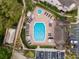 An octagonal community pool with surrounding lounge chairs at 696 Youngstown Pkwy # 307, Altamonte Springs, FL 32714