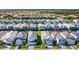 Aerial view showing home's location in a community with a lake at 7212 Oakmoss Loop, Davenport, FL 33837