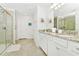 Elegant bathroom with granite countertop and walk-in shower at 7212 Oakmoss Loop, Davenport, FL 33837