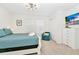 Comfortable bedroom with white sleigh bed and teal bedding at 7212 Oakmoss Loop, Davenport, FL 33837