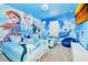 Charming bedroom with Frozen-themed murals and twin beds at 7212 Oakmoss Loop, Davenport, FL 33837