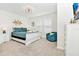 Spacious bedroom with white sleigh bed and teal bedding at 7212 Oakmoss Loop, Davenport, FL 33837