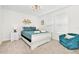 Bright bedroom with white sleigh bed and teal accents at 7212 Oakmoss Loop, Davenport, FL 33837