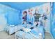 Lovely twin bedroom with Frozen theme and murals at 7212 Oakmoss Loop, Davenport, FL 33837