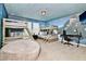 Bedroom with bunk beds, Harry Potter mural, and a gaming setup at 7212 Oakmoss Loop, Davenport, FL 33837