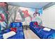Twin bedroom featuring a Spiderman theme and mural at 7212 Oakmoss Loop, Davenport, FL 33837