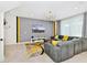 Spacious living area with gray sectional sofa and large TV at 7212 Oakmoss Loop, Davenport, FL 33837