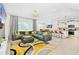 Open concept living space with gray sectional sofa and modern decor at 7212 Oakmoss Loop, Davenport, FL 33837