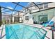 Enjoy this refreshing screened pool and patio area at 7212 Oakmoss Loop, Davenport, FL 33837