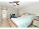 Bedroom with a large bed, ceiling fan and adjacent bathroom at 1111 Clubside Dr # 1111, Longwood, FL 32779