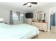 Primary bedroom with ceiling fan, dresser and large bed at 1111 Clubside Dr # 1111, Longwood, FL 32779