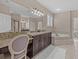 Luxurious bathroom with granite countertops and a soaking tub at 12023 Gold Creek Trl, Windermere, FL 34786