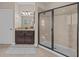 Elegant bathroom with granite vanity, large shower, and tile flooring at 12023 Gold Creek Trl, Windermere, FL 34786