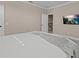 Bedroom with large bed and access to upper floor at 12023 Gold Creek Trl, Windermere, FL 34786
