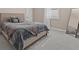 Cozy bedroom with plush bedding, large mirror, and plenty of natural light at 12023 Gold Creek Trl, Windermere, FL 34786