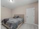 Spacious bedroom with large bed and door at 12023 Gold Creek Trl, Windermere, FL 34786