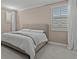Bedroom with large bed and window shutters at 12023 Gold Creek Trl, Windermere, FL 34786