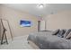 Bedroom with large bed, TV and mirror at 12023 Gold Creek Trl, Windermere, FL 34786