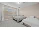 Comfortable bedroom with two twin beds and ample space at 12023 Gold Creek Trl, Windermere, FL 34786