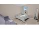 Small bedroom with full-size bed, sofa, and ample natural light at 12023 Gold Creek Trl, Windermere, FL 34786
