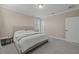 Bedroom with large bed and window shutters at 12023 Gold Creek Trl, Windermere, FL 34786
