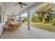 Spacious covered patio with dining area and backyard access at 12023 Gold Creek Trl, Windermere, FL 34786