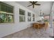 Covered patio with outdoor dining set and ceiling fan at 12023 Gold Creek Trl, Windermere, FL 34786