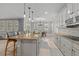 Spacious kitchen with granite island, stainless steel appliances, and custom cabinetry at 12023 Gold Creek Trl, Windermere, FL 34786