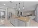 Large kitchen island with granite countertop and seating for four at 12023 Gold Creek Trl, Windermere, FL 34786